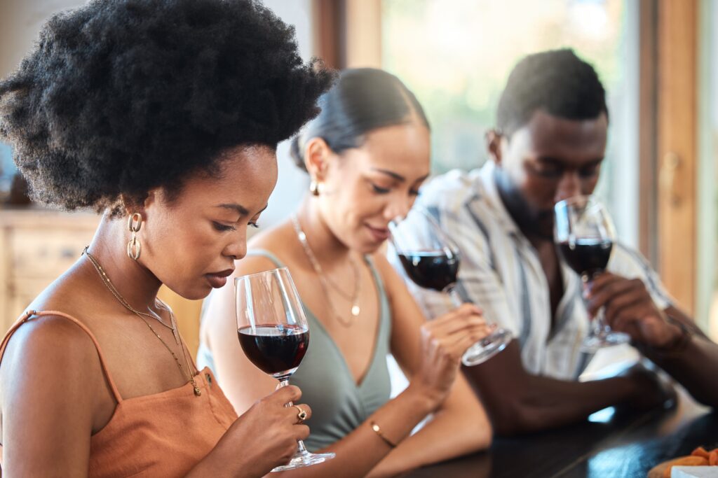 people sniffing wine