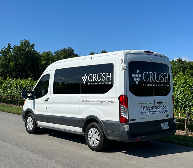white transportation van with crush logo on the side